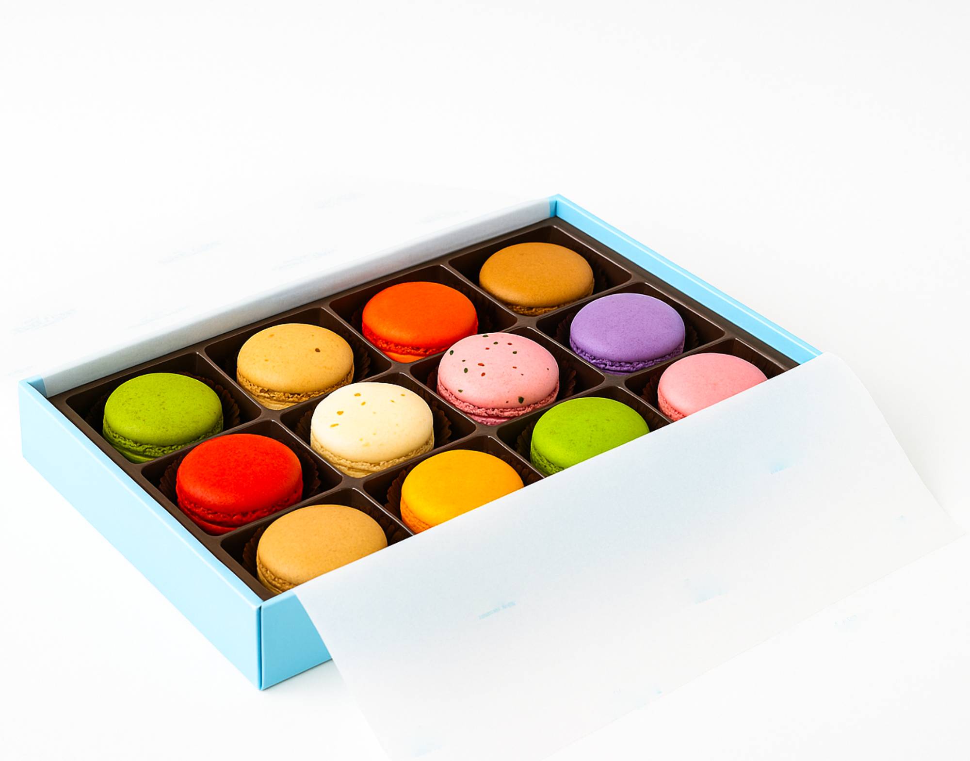 Box of 12 colorful French macarons in assorted flavors in a light blue gift box
