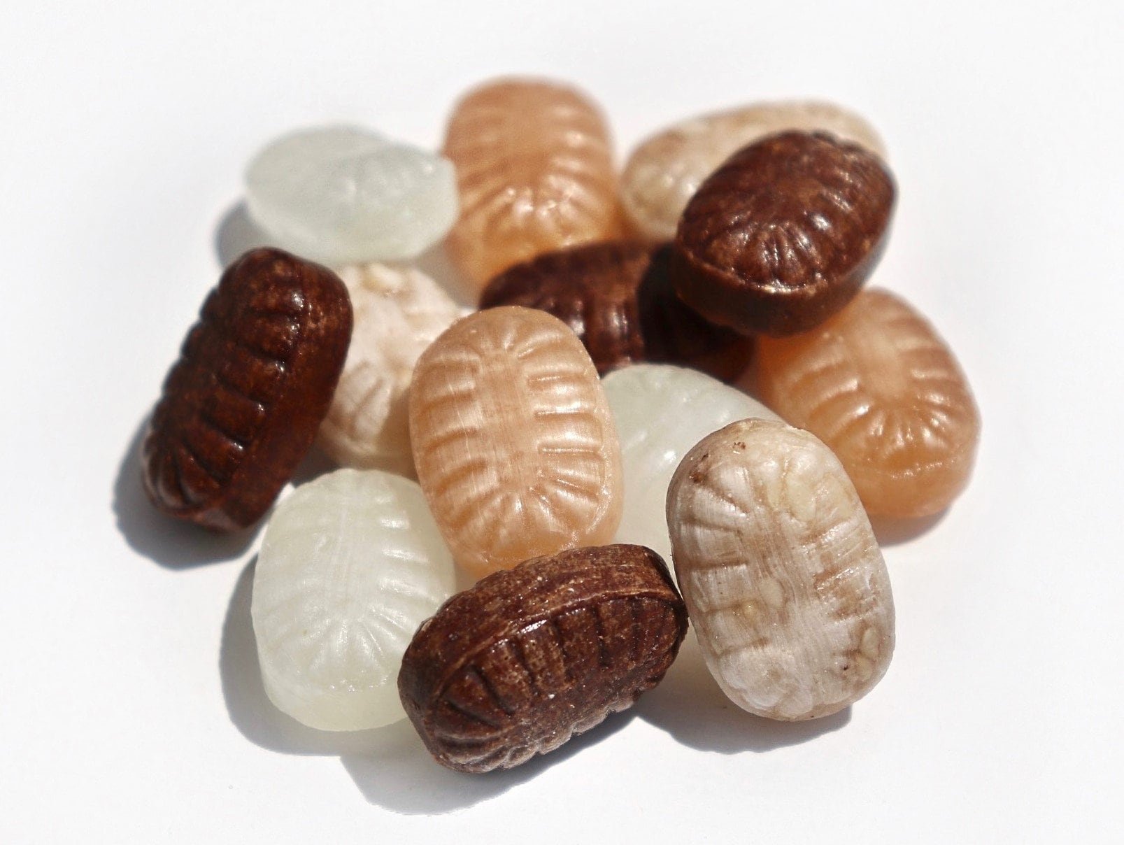 Sugar Free Hard Candy A close-up image of an assortment of Andy Anand's 70 Pc Sugar-Free Hard Candies in various flavors such as ginger, coffee, toasted sesame, strong menthol, and propolis, sweetened with natural stevia. Andy Anand Chocolates, All Products, Products, Sugar Free Candy