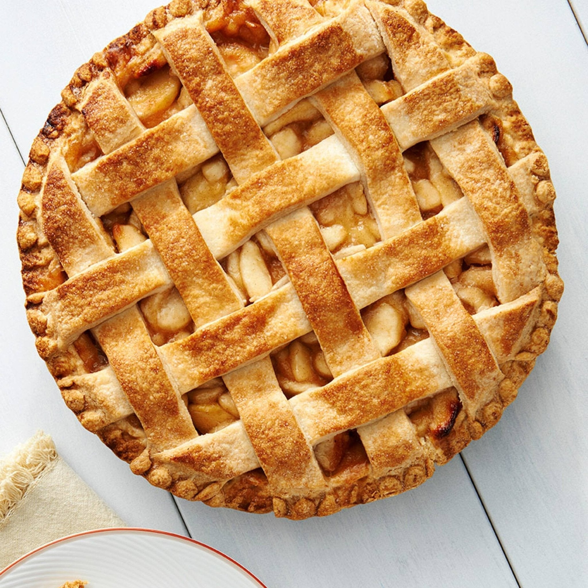 Apple Pie Delectable lattice-topped apple pie crafted by Andy Anand Chocolates, a premium brand known for their high-quality, all-natural ingredients and artful presentation. This decadent treat, part of their line of All Products and Pies, is sure to satisfy your sweet cravings.
