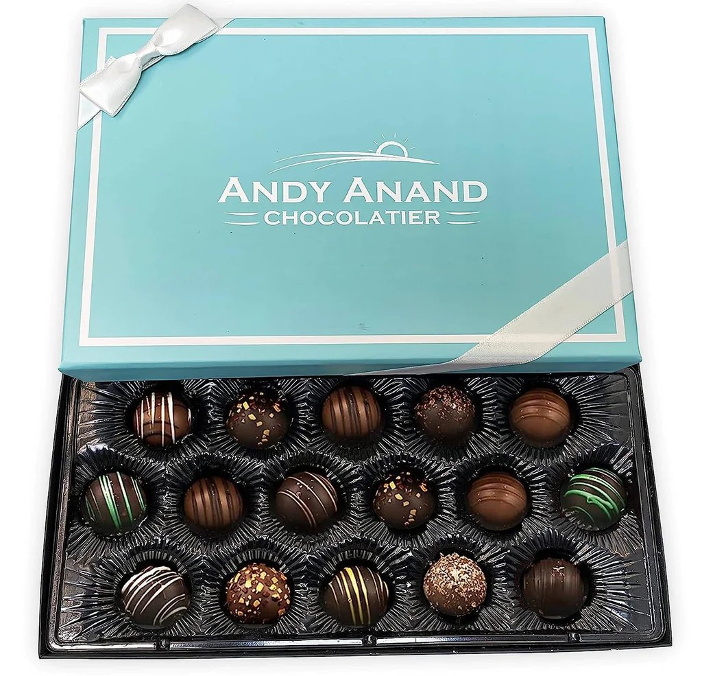 Dark Chocolate Truffles Handcrafted artisan dark chocolate truffles, a delightful assortment of flavors delicately presented in a signature blue gift box. Andy Anand Chocolates, All Products, Products, Chocolate Truffles- Free 2nd Day Air