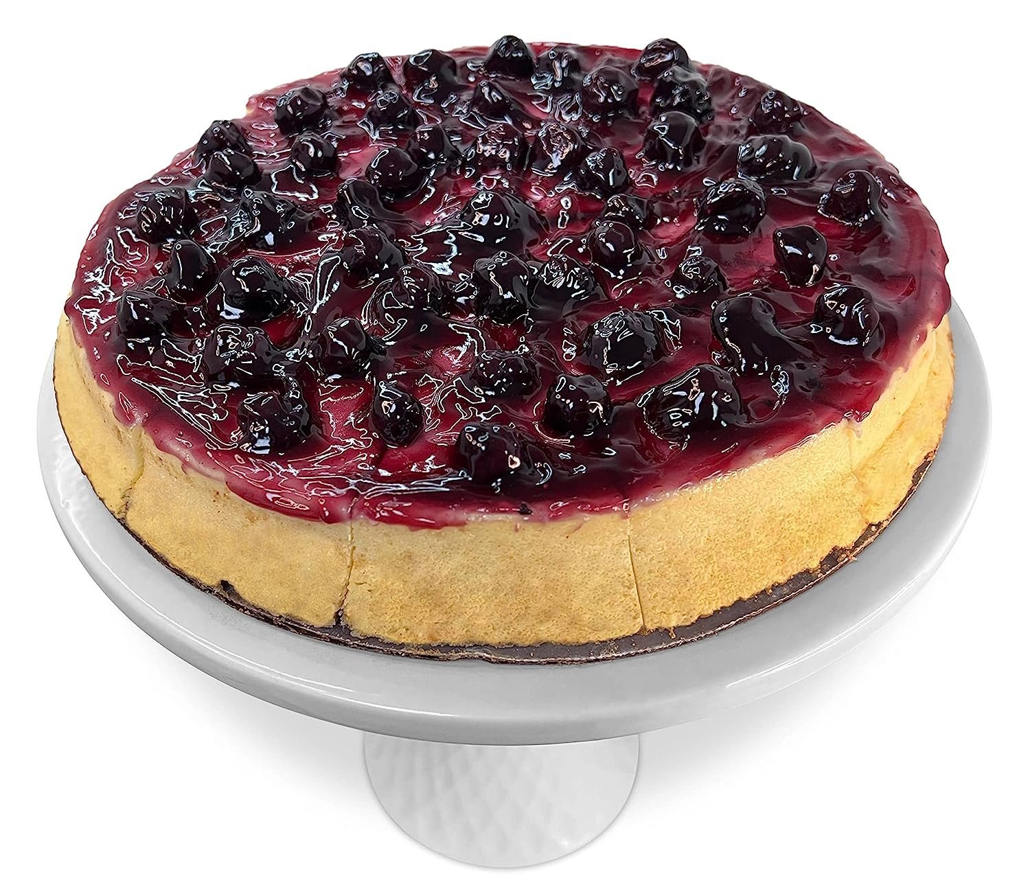 9-inch blueberry cheesecake topped with glazed fresh blueberries on a white cake stand