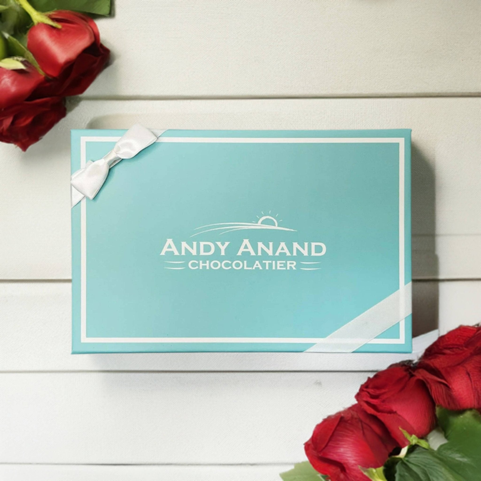 Andy Anand 9-inch, 2.8 lbs chocolate strawberry cheesecake, real chocolate truffles, beautifully presented in a gift box.
