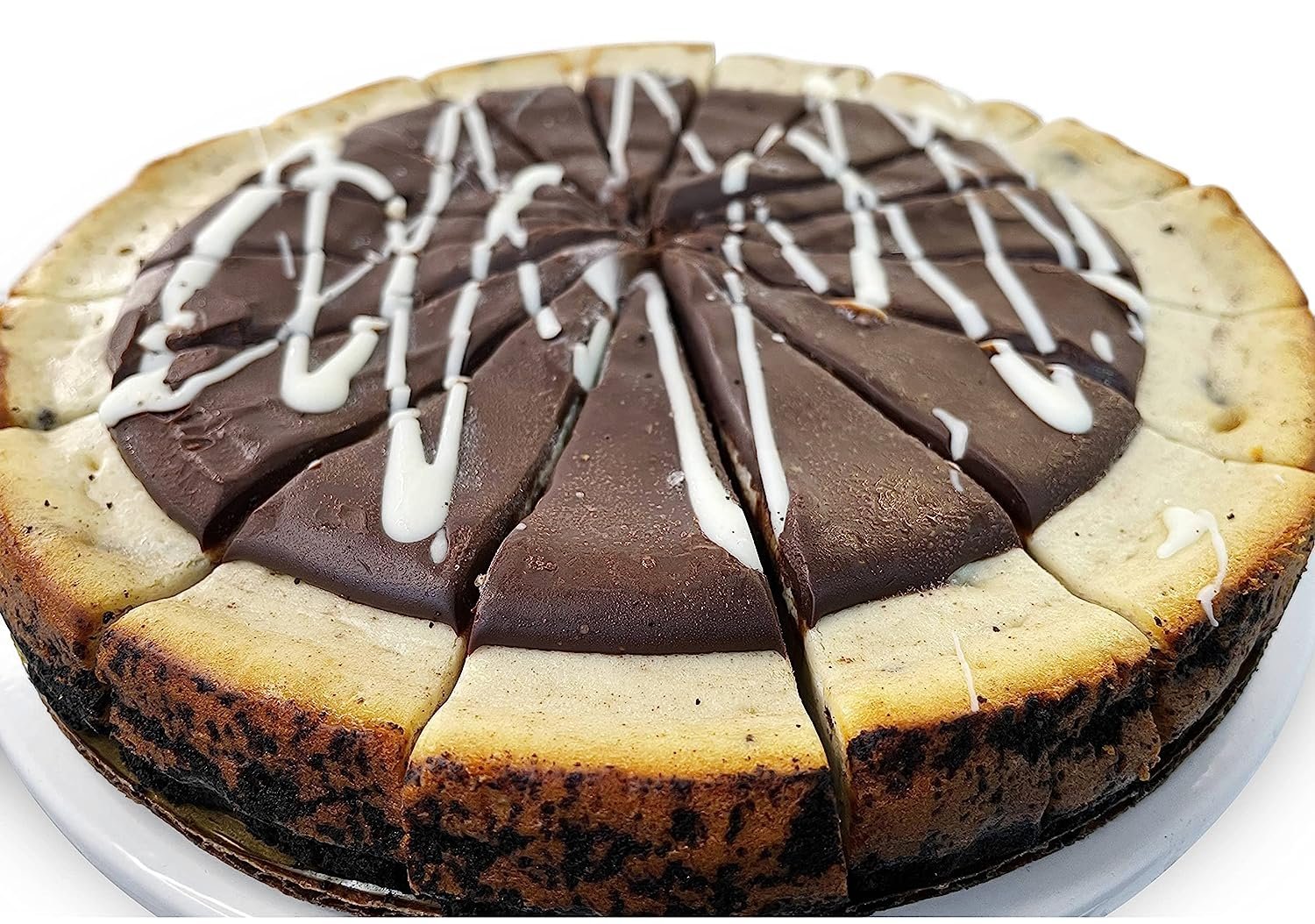 9-inch Cookies and Cream Cheesecake with chocolate topping and white drizzle, freshly baked, sliced and ready to serve
