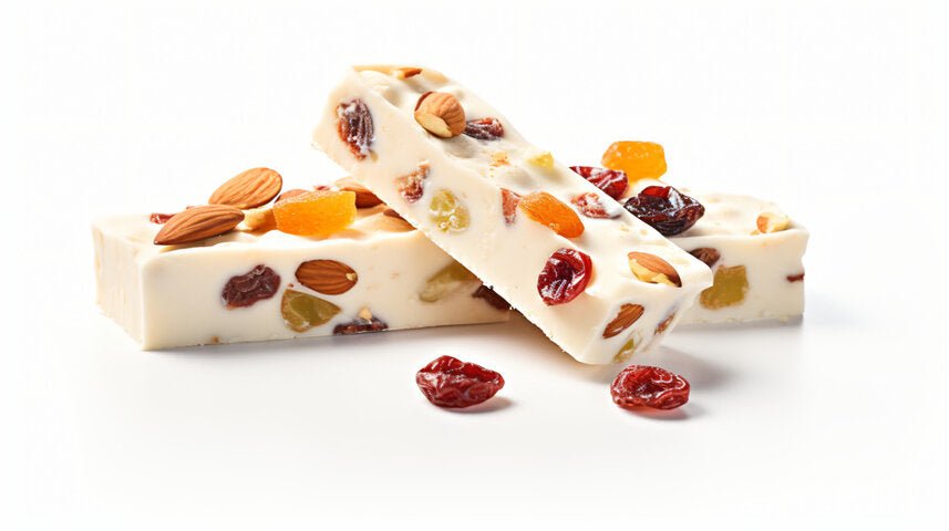 Red Fruit Almond Nougat Delectable roasted almonds, vibrant red fruits, and decadent nougat turron - an enticing gourmet confection from Andy Anand Chocolates. All Products, Products, Soft Brittle Nougat, -Brittle, Brittle / Turron