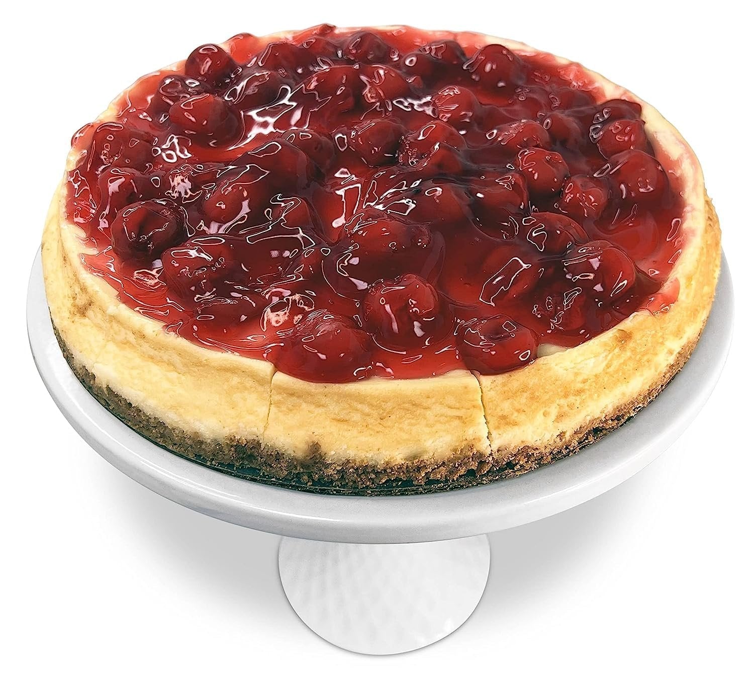 Sugar free cherry cheesecake with creamy texture topped with fresh cherries on white cake stand