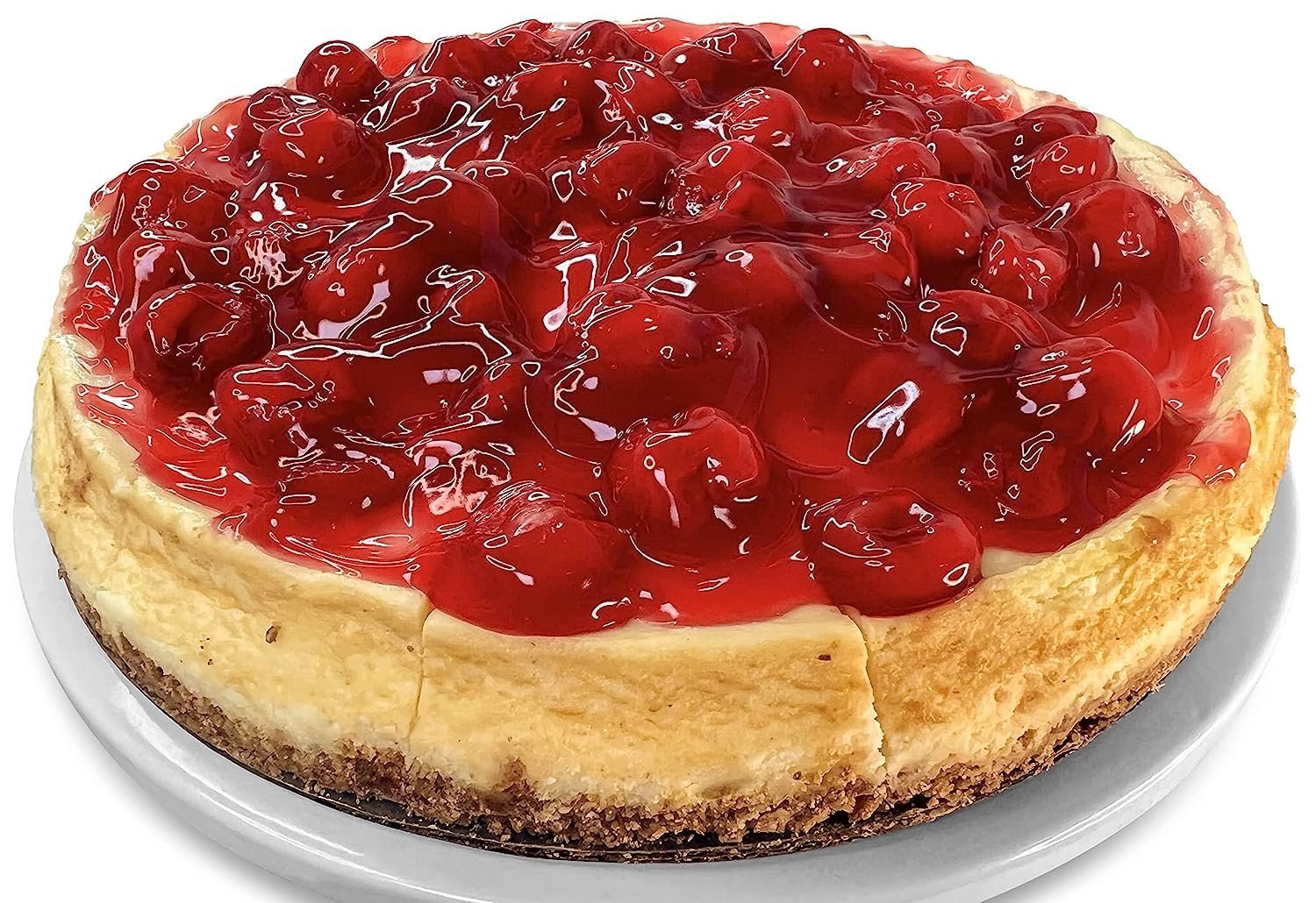 Andy Anand freshly baked 9-inch traditional cherry cheesecake with creamy filling and glossy cherry topping on white plate