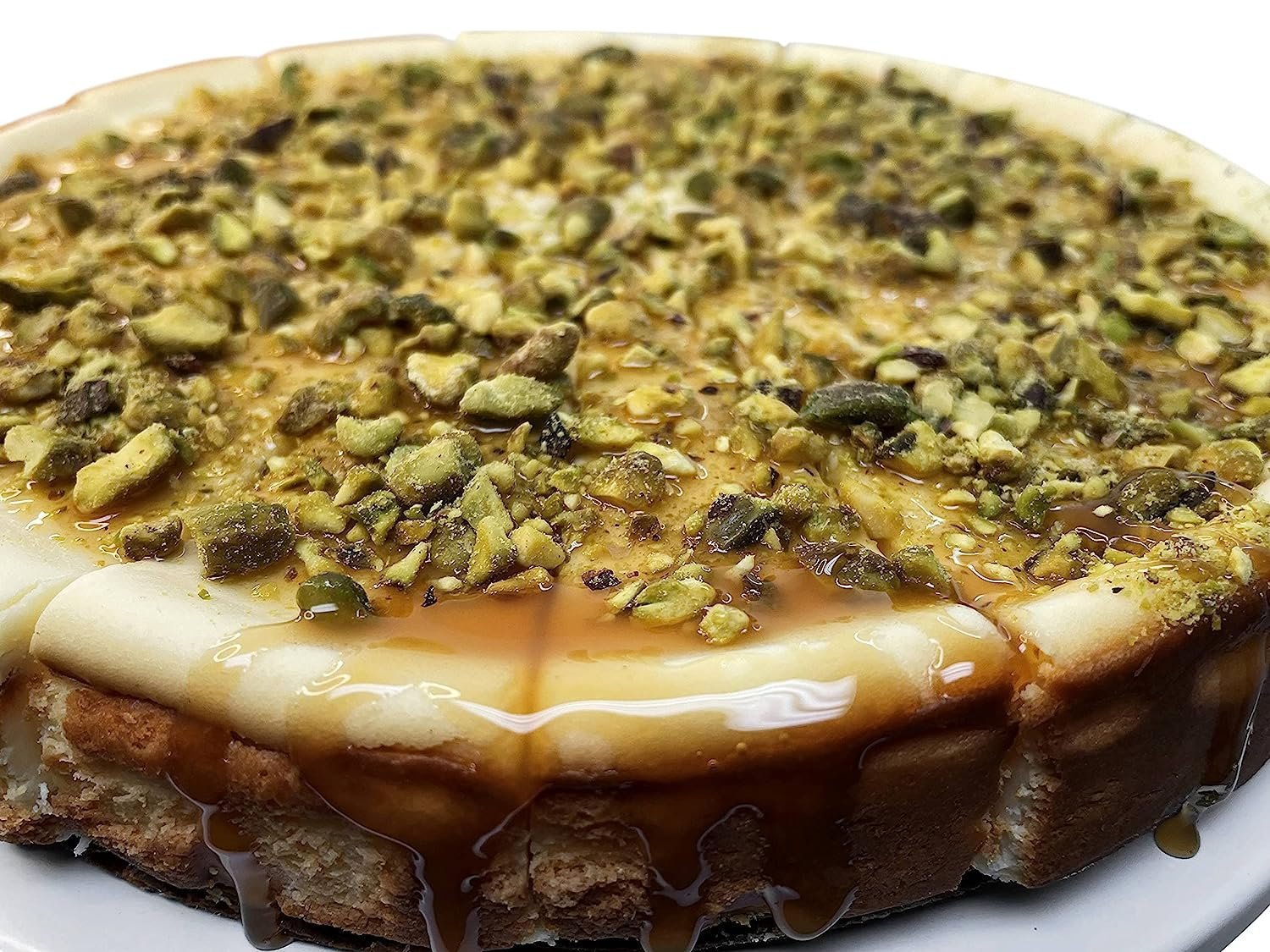 Andy Anand Chocolates Food & Beverages > Desserts & Sweets > Cakes > Gluten-Free Cheesecakes Andy Anand Gluten-Free Caramel Pistachio Cheesecake, 9-Inch, 2 lb – Freshly Baked, Real California Cream Cheese, No Preservatives Gift Box Gluten-Free Caramel Pistachio Cheesecake | Nationwide