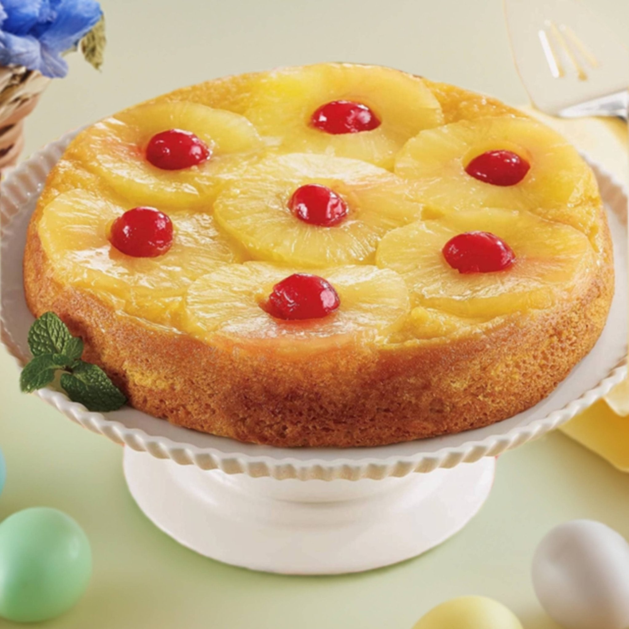 A classic Gluten Free Pineapple Upside-Down Cake, featuring caramelized pineapple slices and maraschino cherries a top