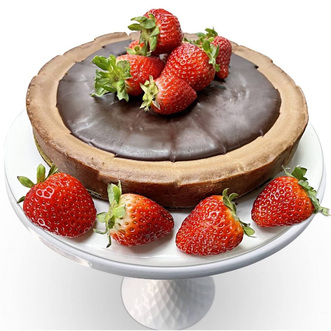 Gluten Free Triple Chocolate Cake topped with fresh strawberries on a white cake stand