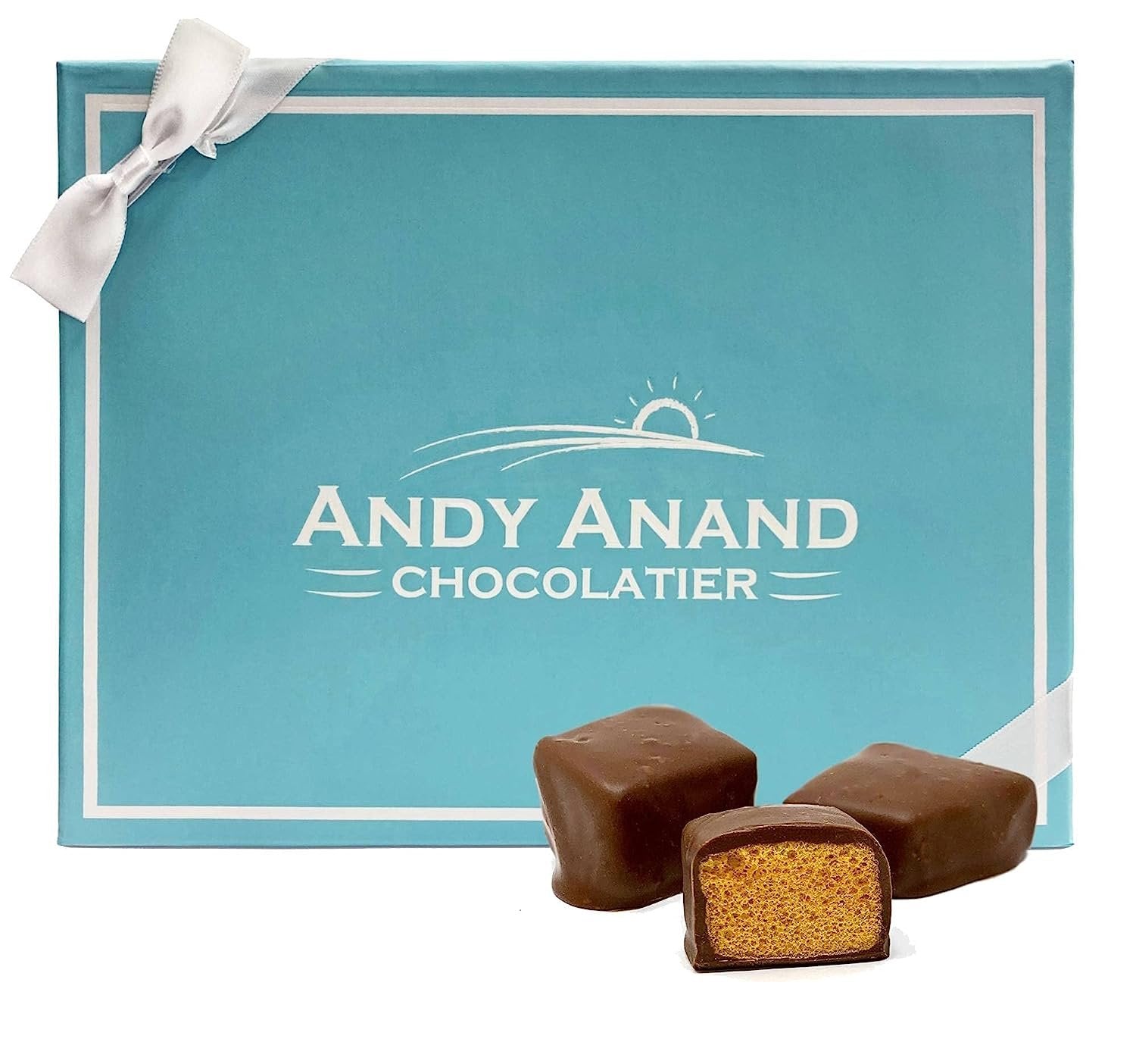 Honeycomb Milk Chocolate Andy Anand Honeycomb Milk Chocolate gift box with three pieces of crispy honeycomb milk chocolate, one cut open showing airy texture inside