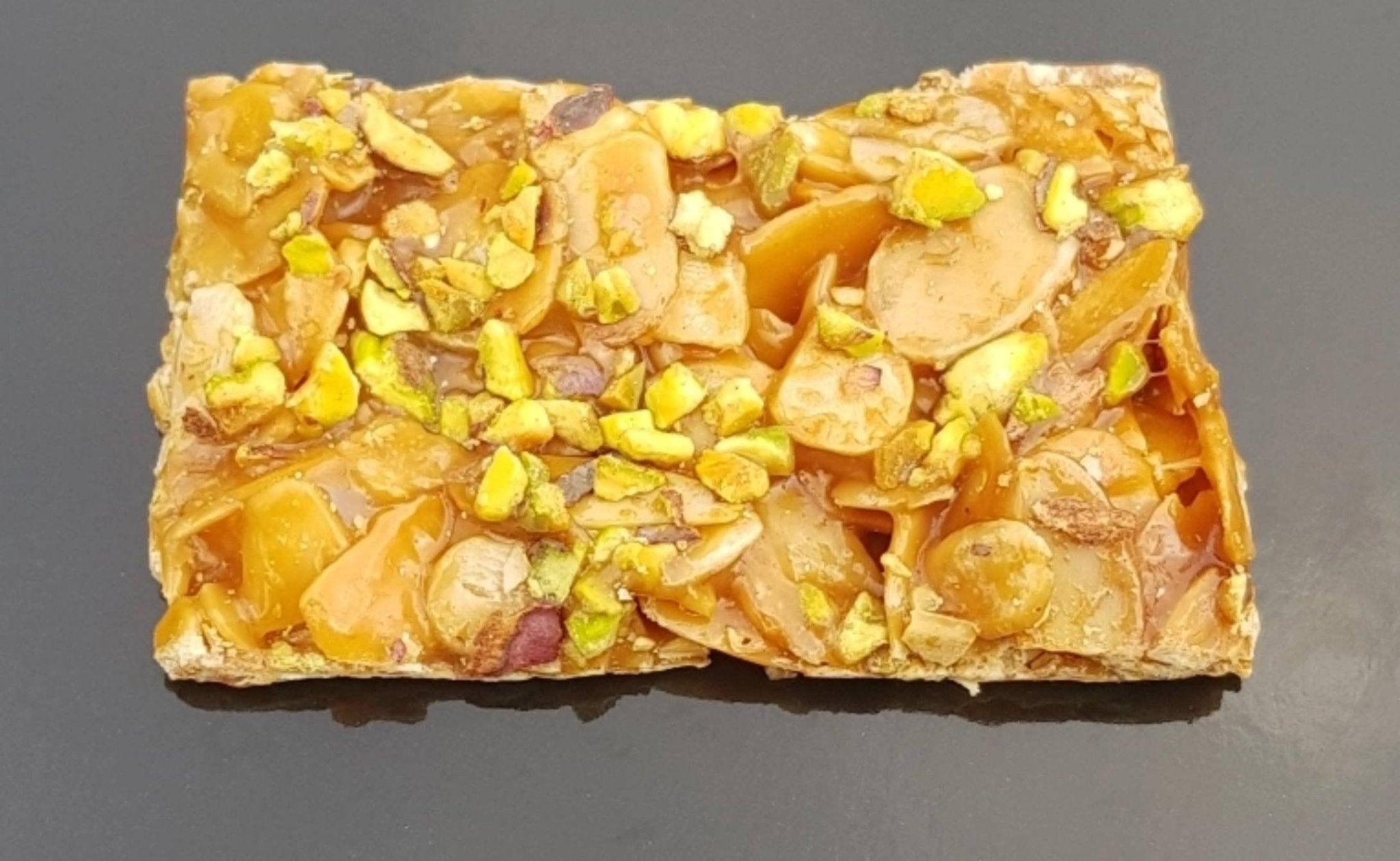 Crunchy Italian pistachio brittle with honey and almonds, made in Sicily by La Pasticceria, 7 oz pack.