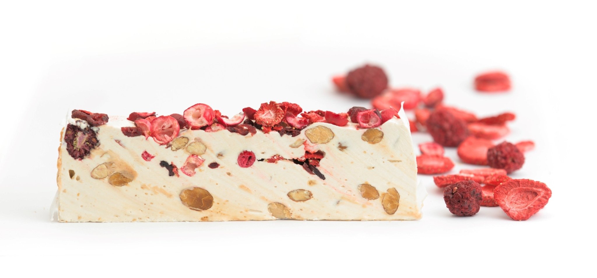 Gluten Free Strawberry Nougat Delectable strawberry and soft nougat confection with roasted almond bits, created using traditional Spanish methods. A gourmet indulgence from Andy Anand Chocolates, offering all-natural ingredients and an irresistible taste. Andy Anand Chocolates, All Products, Products, Soft Brittle Nougat, -Brittle, Brittle / Turron