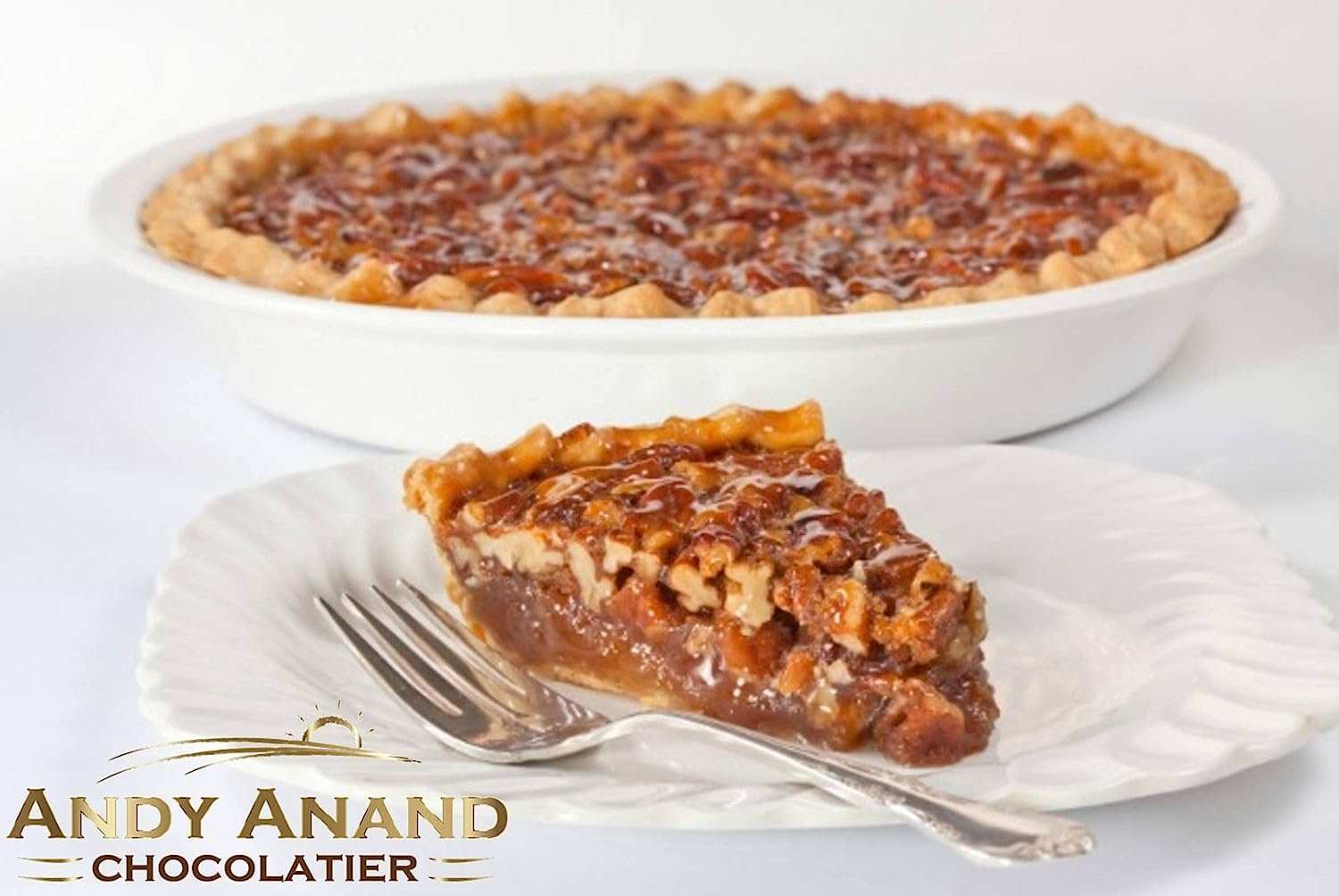Mouthwatering traditional pecan pie with crunchy topping, creamy filling, and flaky crust, artfully crafted by Andy Anand Chocolates. All Products, Products, Pies