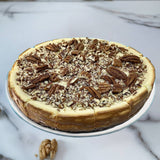 Delectable caramel walnut cheesecake with a rich, creamy texture and a topping of caramelized walnuts, crafted by expert bakers. Andy Anand Chocolates, All Products, Products, Cheesecake Regular.