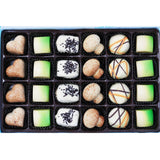 Handcrafted Belgian white chocolate truffles in an assorted gift box, featuring a variety of flavors and shapes including heart, pistachio, and swirled designs. Andy Anand Chocolates, All Products, Products, Chocolate Truffles- Free 2nd Day Air, White Chocolate