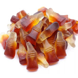 Colorful assortment of sugar-free cola gummy candies in the shape of mini bottles, showcasing an explosively fruity and unbelievably sugar-free treat. Andy Anand Chocolates, All Products, Products.