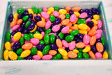 Colorful assortment of sugar-free pastel Jordan almonds in a variety of hues, including pink, blue, white, and yellow, to delight the senses. Andy Anand Chocolates, All Products, Products.