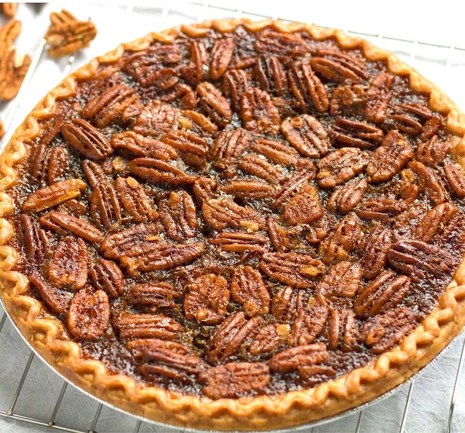 Delicious traditional pecan pie with a golden-brown crust and a rich, creamy filling studded with crunchy pecans. Andy Anand Chocolates, All Products, Products, Pies.
